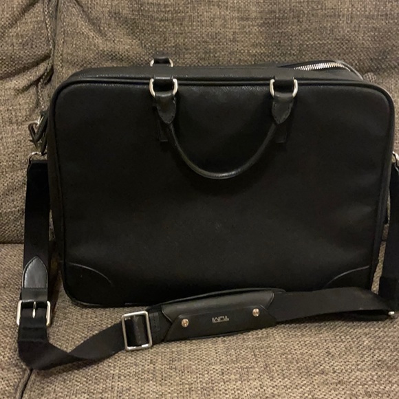 Tumi waxed cotton and leather bag $325